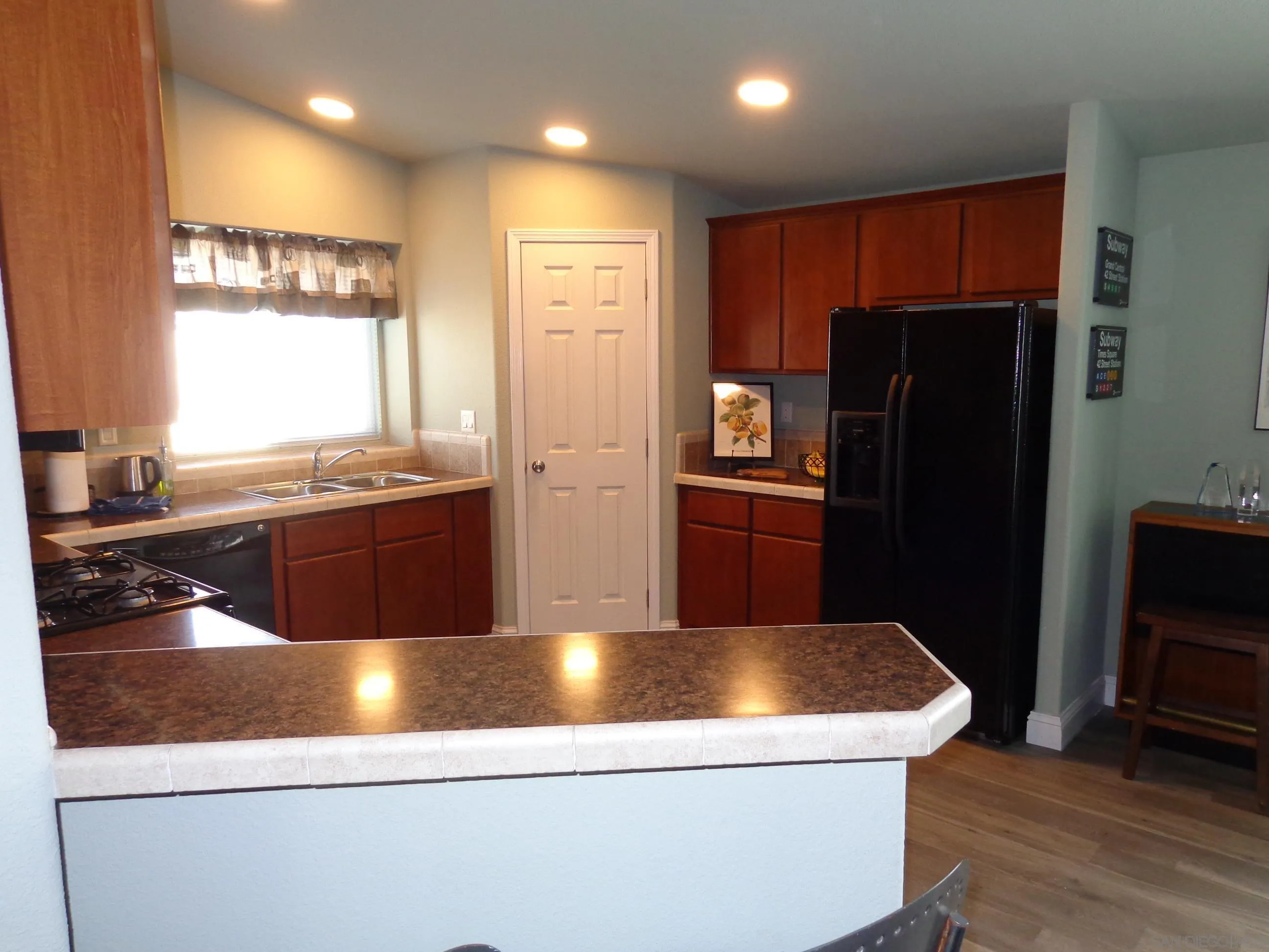 43 Havenview Lane Oceanside, CA 92056 - Photo 14 of 24 a kitchen with stainless steel appliances granite countertop a refrigerator a sink a stove a microwave a counter space and cabinets