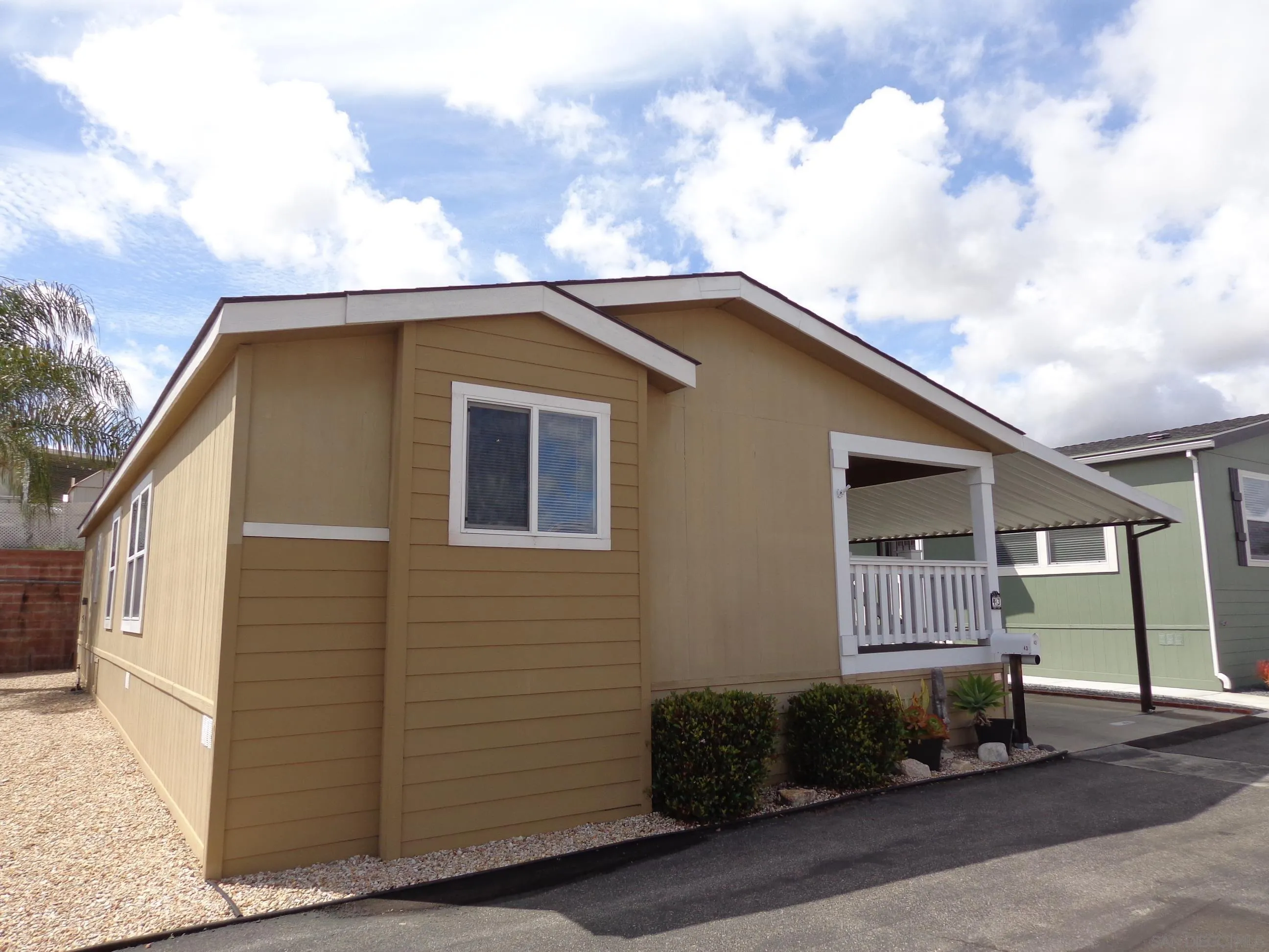 43 Havenview Lane Oceanside, CA 92056 - Photo 2 of 24 a front view of a house with a garage