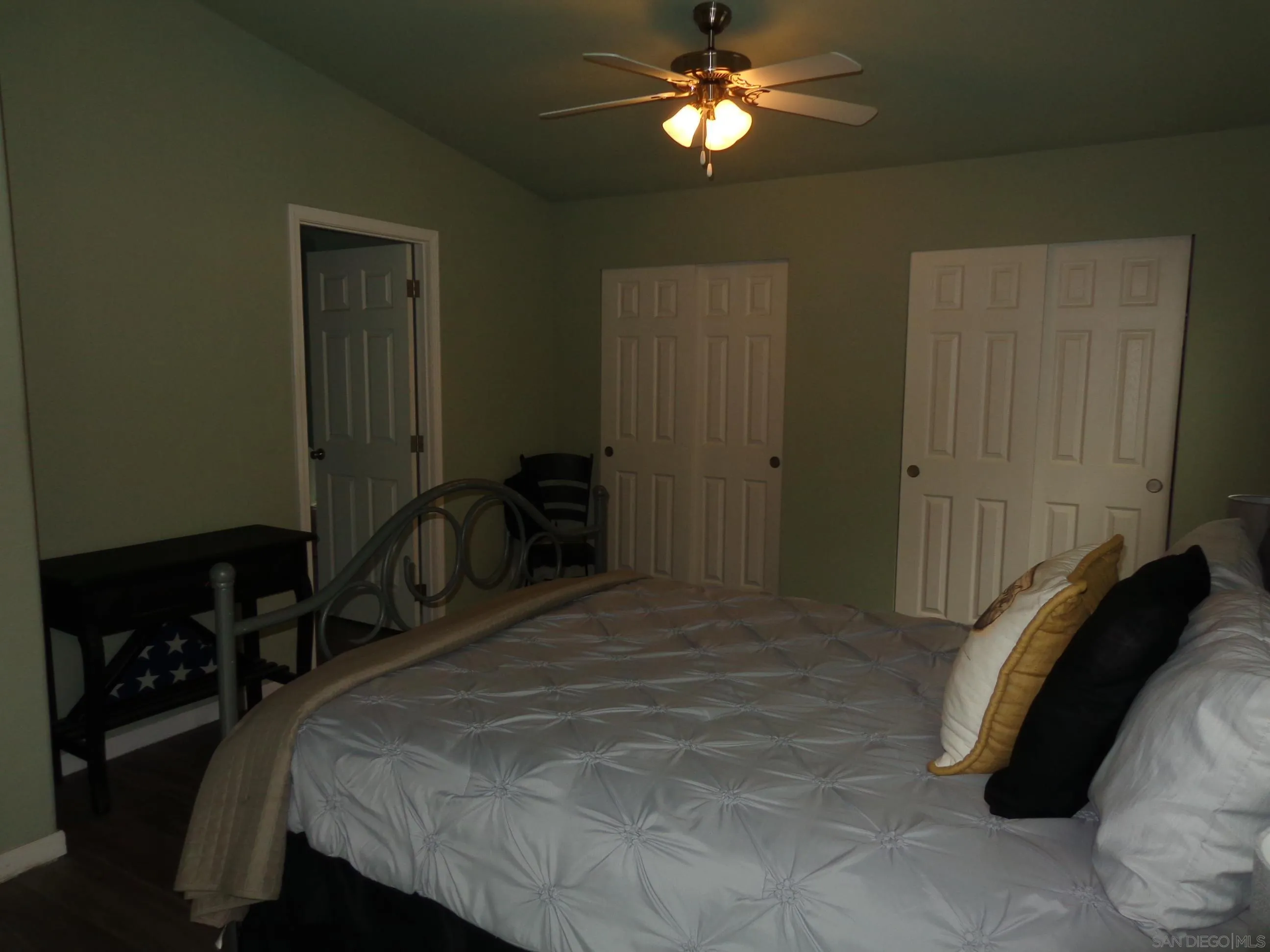 43 Havenview Lane Oceanside, CA 92056 - Photo 21 of 24 a bedroom with a bed and a chandelier