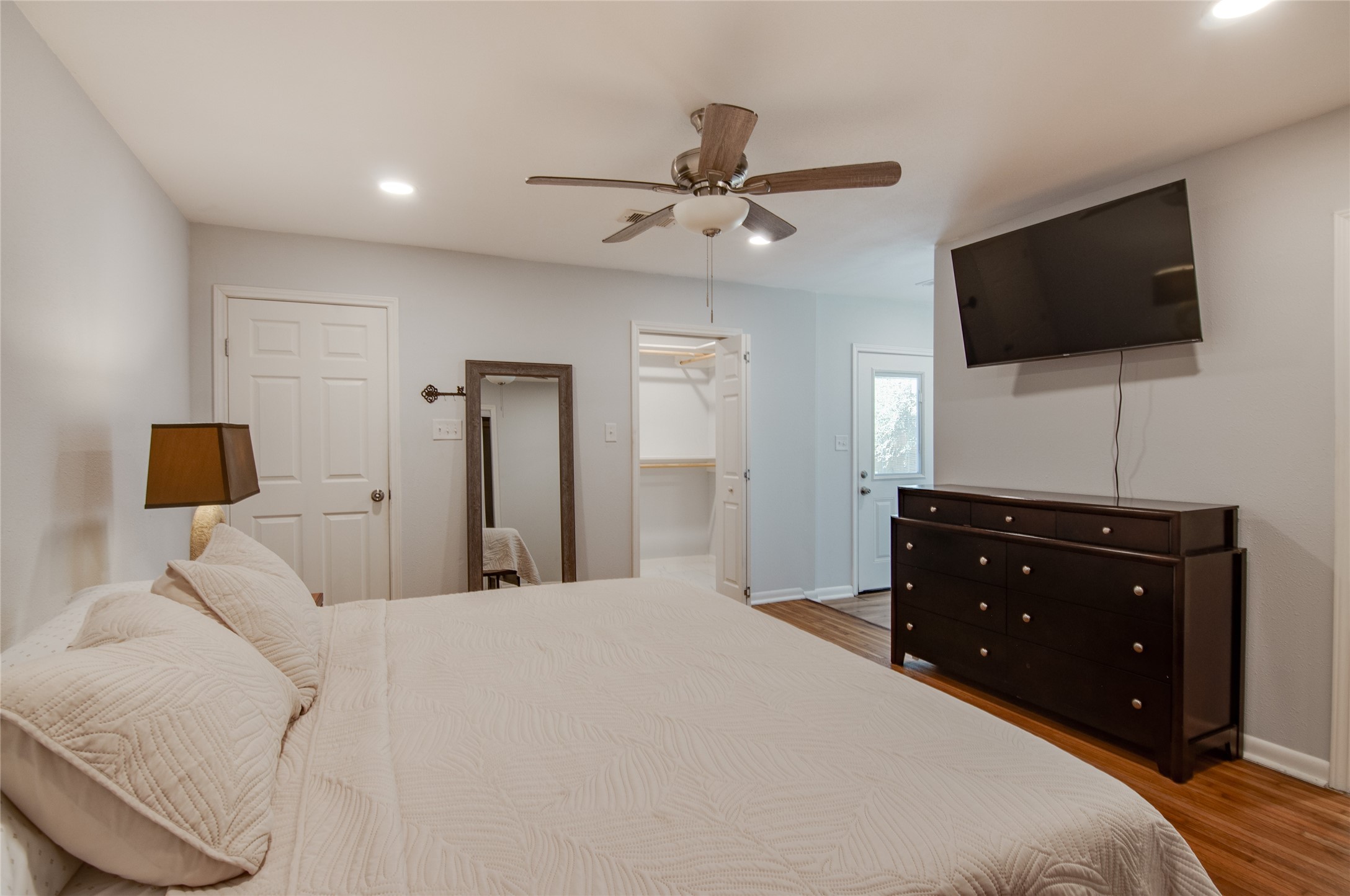 8922 Opelika Street Houston, TX 77080 - Photo 12 of 23 a bedroom with a bed and a flat screen tv