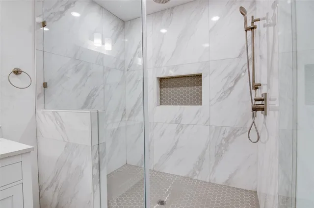 a view of a room with wooden floor and a window