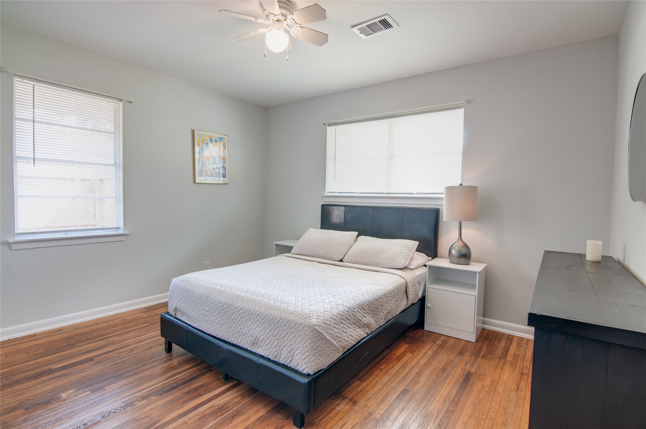 8922 Opelika Street Houston, TX 77080 - Photo 19 of 23 a bedroom with a bed and window