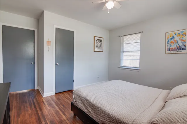 a bedroom with a bed and window