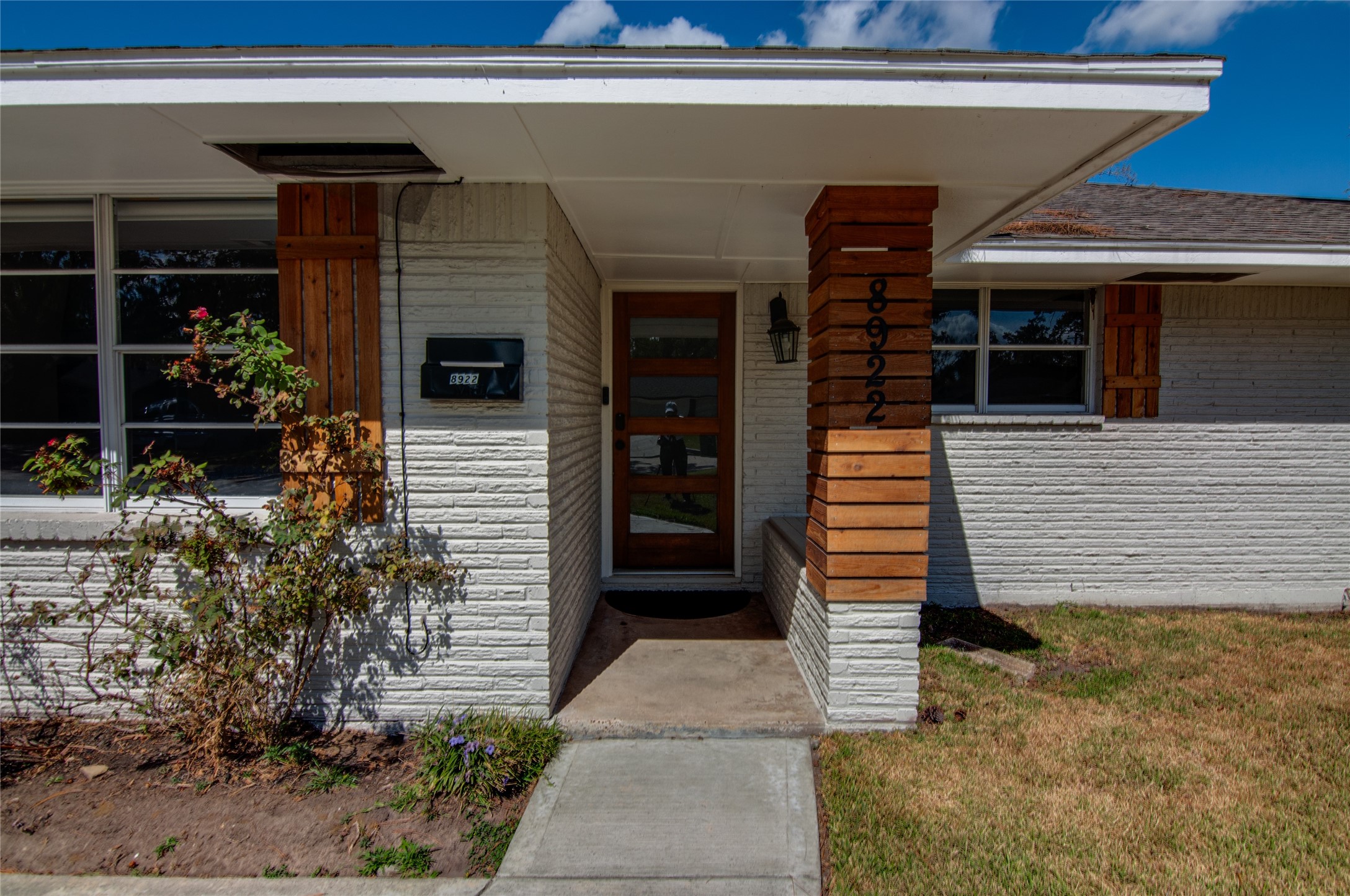 8922 Opelika Street Houston, TX 77080 - Photo 2 of 23 a front view of a house with garden