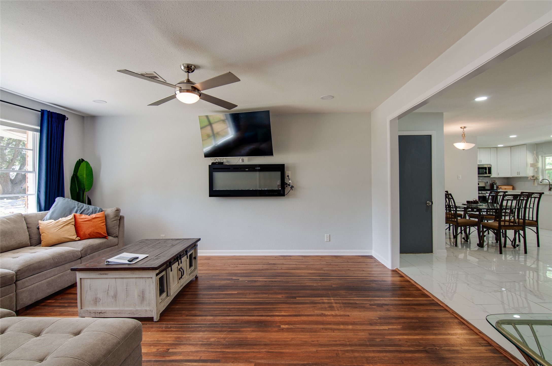 8922 Opelika Street Houston, TX 77080 - Photo 3 of 23 a living room with furniture and a wooden floor