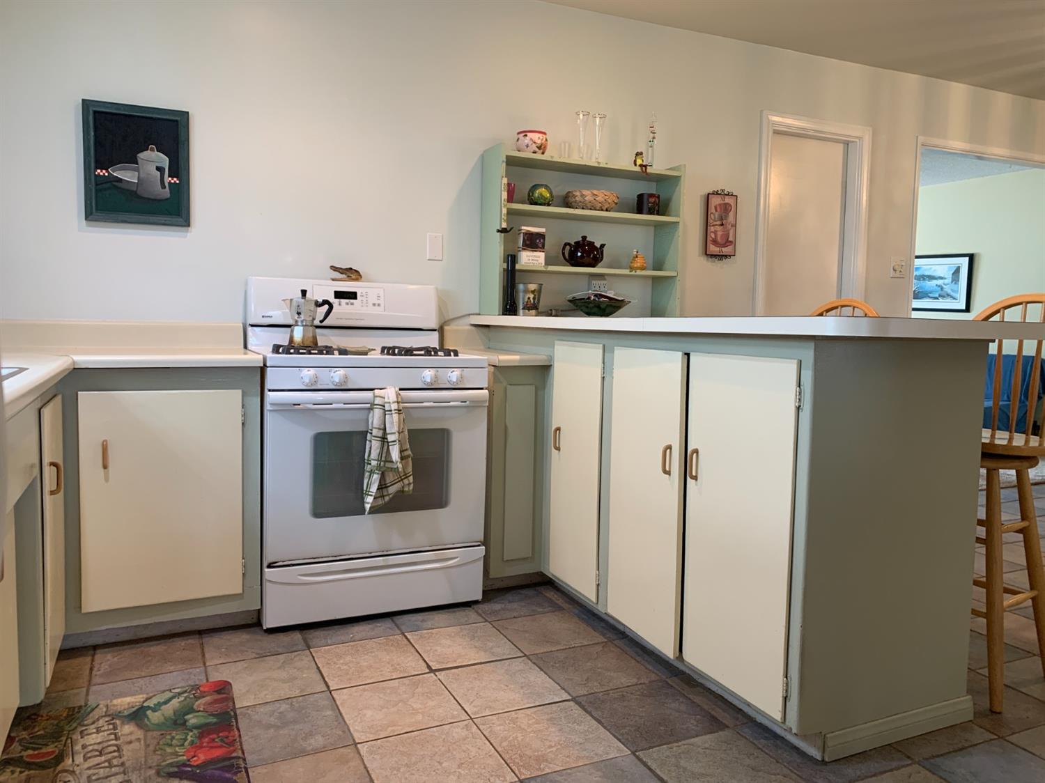 90 Rio Via Oak View, CA 93022 - Photo 5 of 42 a kitchen with a stove and a refrigerator