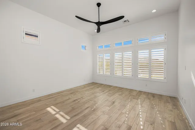 a bedroom with bed and a window