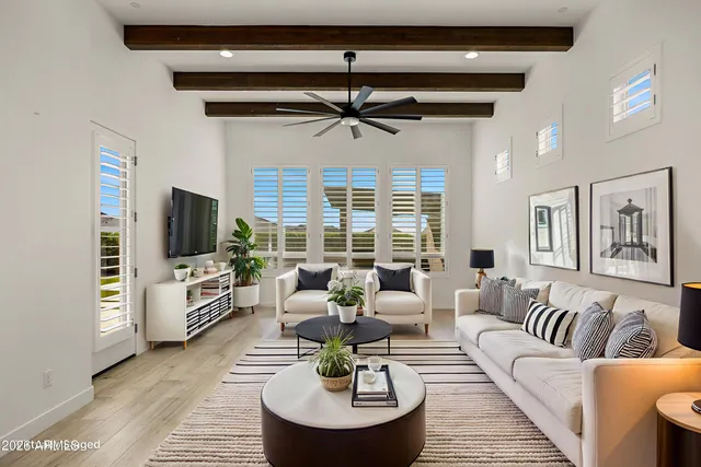 a kitchen with stainless steel appliances granite countertop a sink a stove and a wooden floor