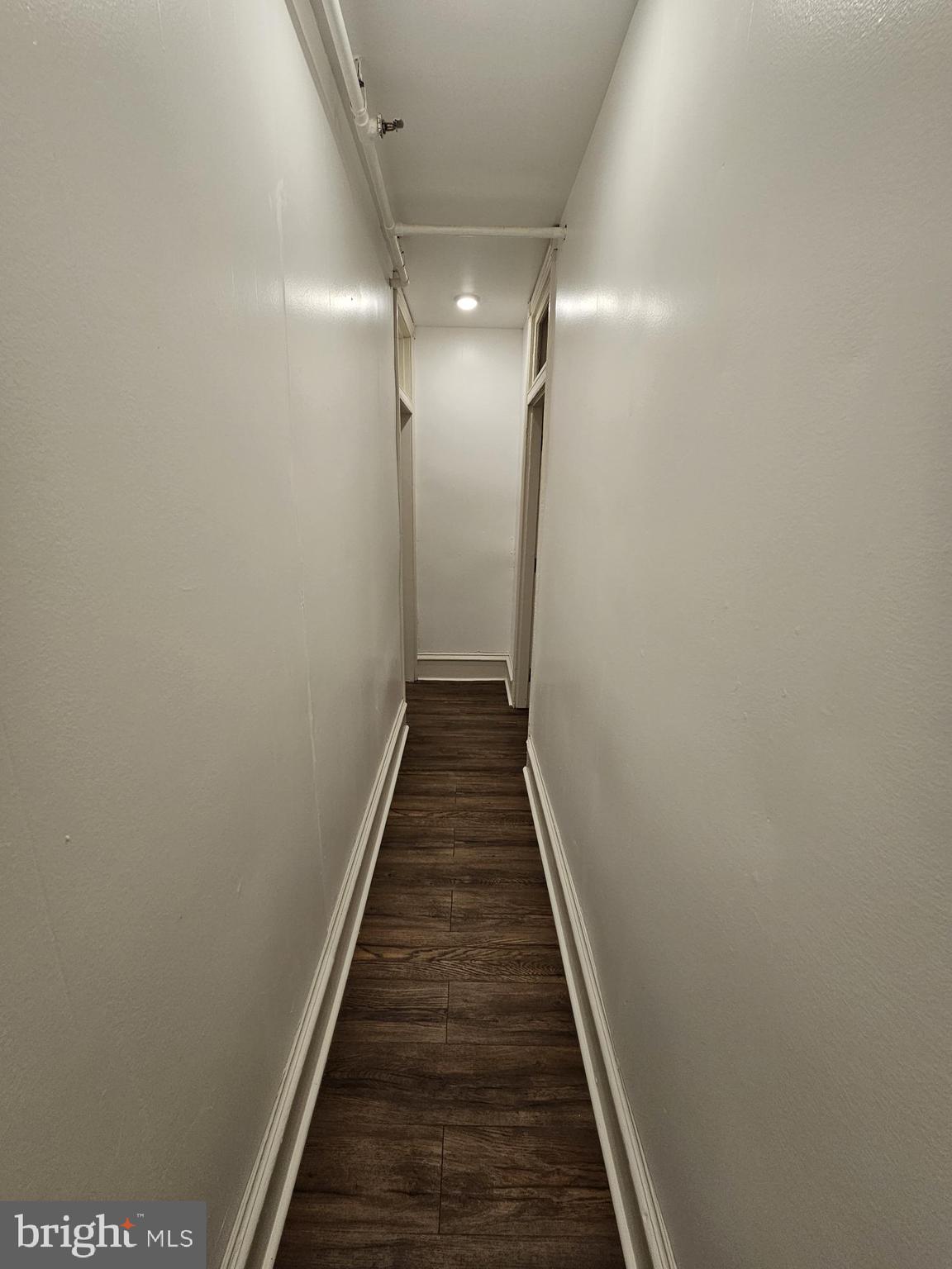 3922 Terrace Street, Unit 3 Philadelphia, PA 19128 - Photo 6 of 10 a view of a hallway with wooden floor and staircase