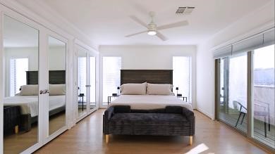 3029 Bering Drive Houston, TX 77057 - Photo 6 of 12 a bedroom with a bed and a chandelier