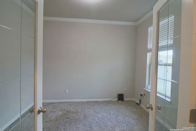 an empty room with windows