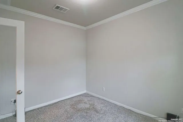 a view of kitchen with stainless steel appliances kitchen island granite countertop a refrigerator and a sink