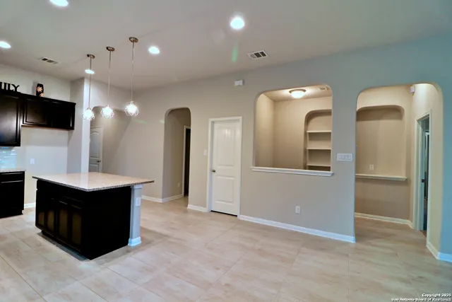 a kitchen with a sink a stove and refrigerator