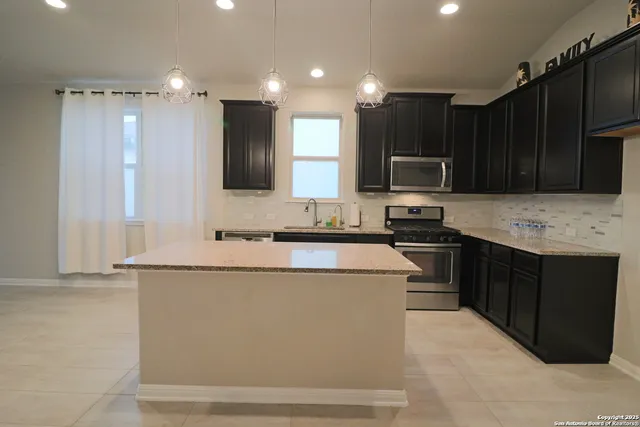 a view of a kitchen from the hallway