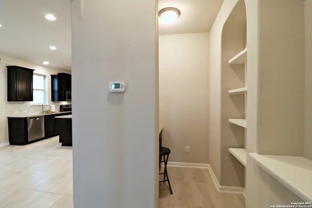 a kitchen with a sink and cabinets