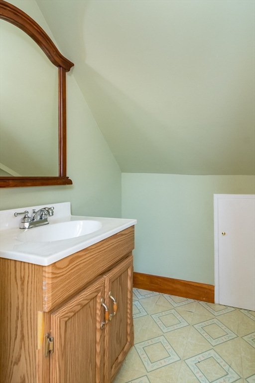 79 Mill Street Natick, MA 01760 - Photo 15 of 21 a bathroom with a sink and a mirror