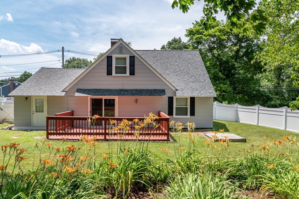 79 Mill Street Natick, MA 01760 - Photo 16 of 21 a front view of house with yard and outdoor seating