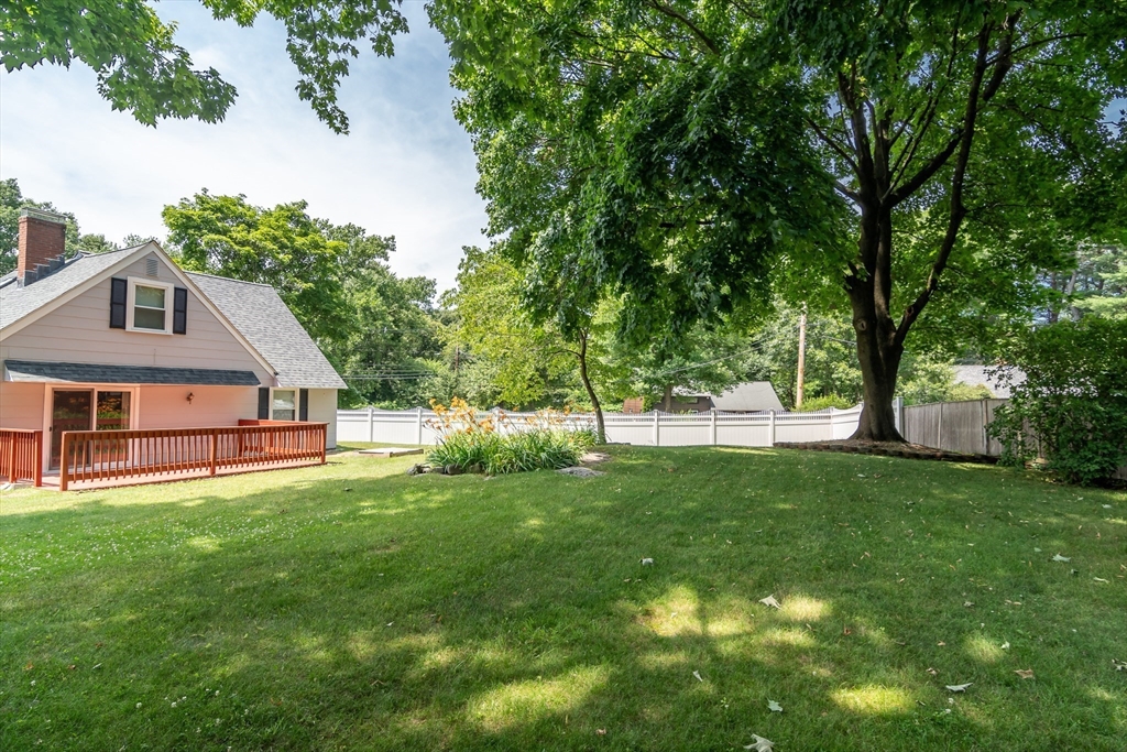 79 Mill Street Natick, MA 01760 - Photo 20 of 21 a front view of a house with a yard