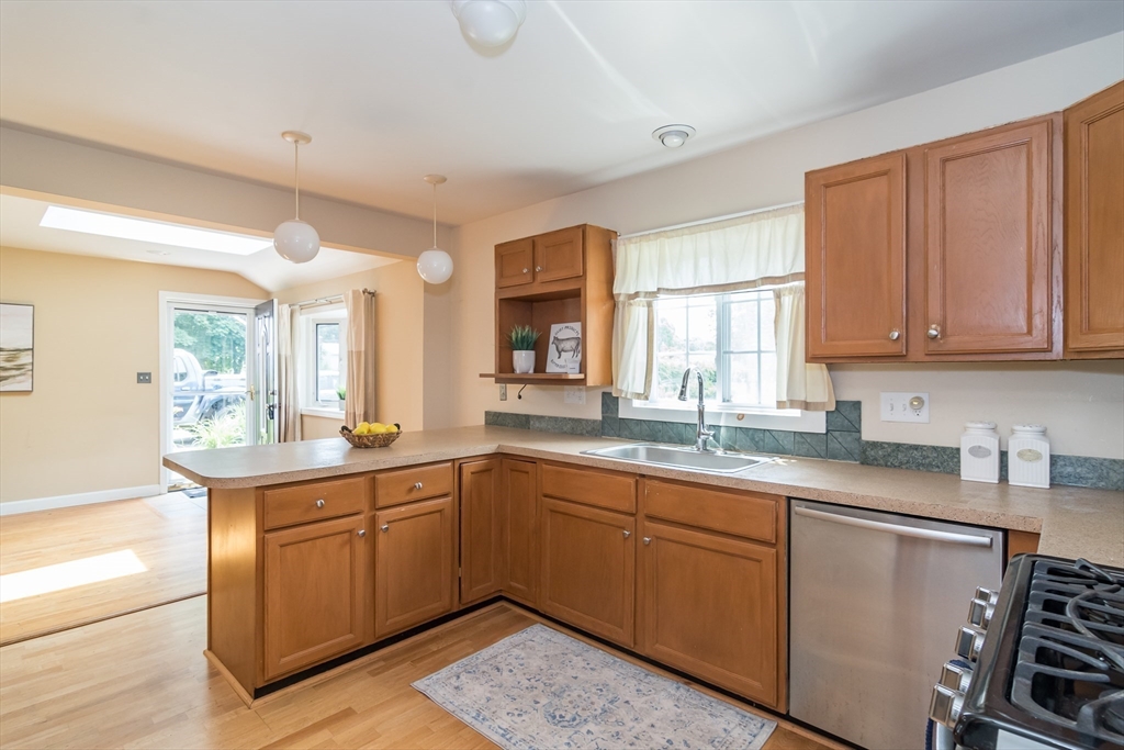 79 Mill Street Natick, MA 01760 - Photo 4 of 21 a kitchen with a sink and cabinets