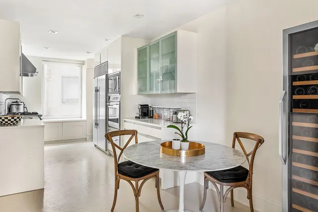 a living room with furniture a rug and a fireplace