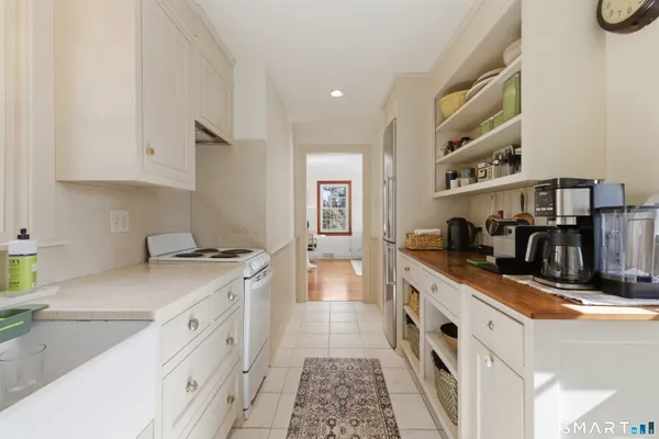 a kitchen with stainless steel appliances granite countertop a stove and a sink