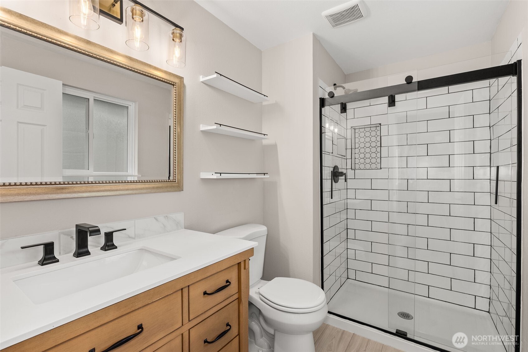 269 Elk Creek Road Raymond, WA 98577 - Photo 13 of 38 a bathroom with a sink a toilet and shower