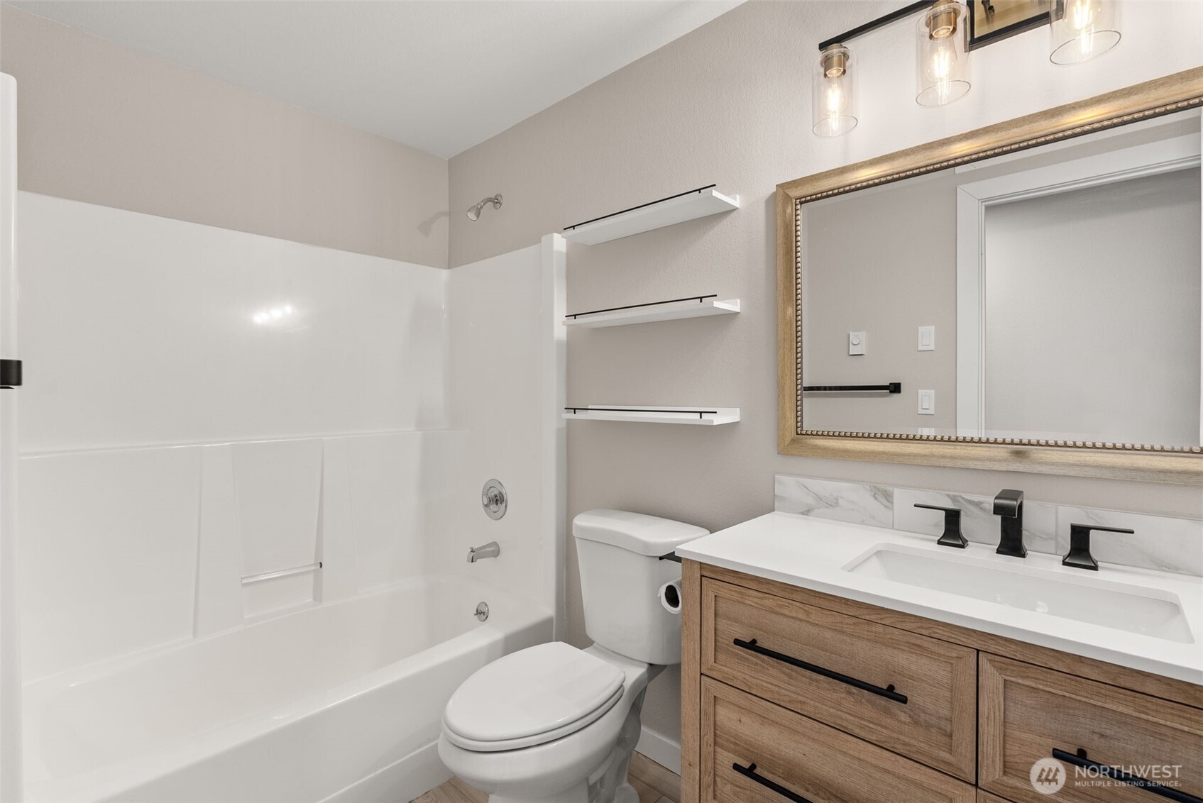 269 Elk Creek Road Raymond, WA 98577 - Photo 15 of 38 a bathroom with a sink a toilet and shower