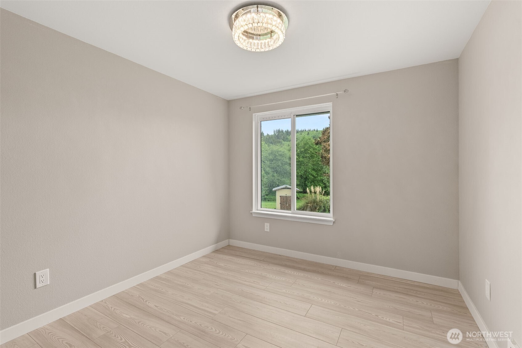 269 Elk Creek Road Raymond, WA 98577 - Photo 16 of 38 an empty room with a window