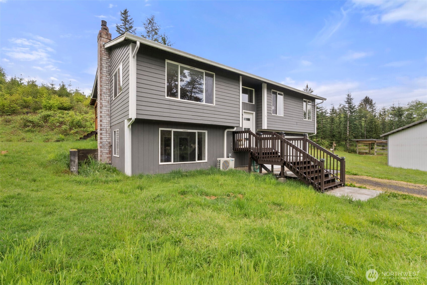 269 Elk Creek Road Raymond, WA 98577 - Photo 2 of 38 a view of a house with a yard