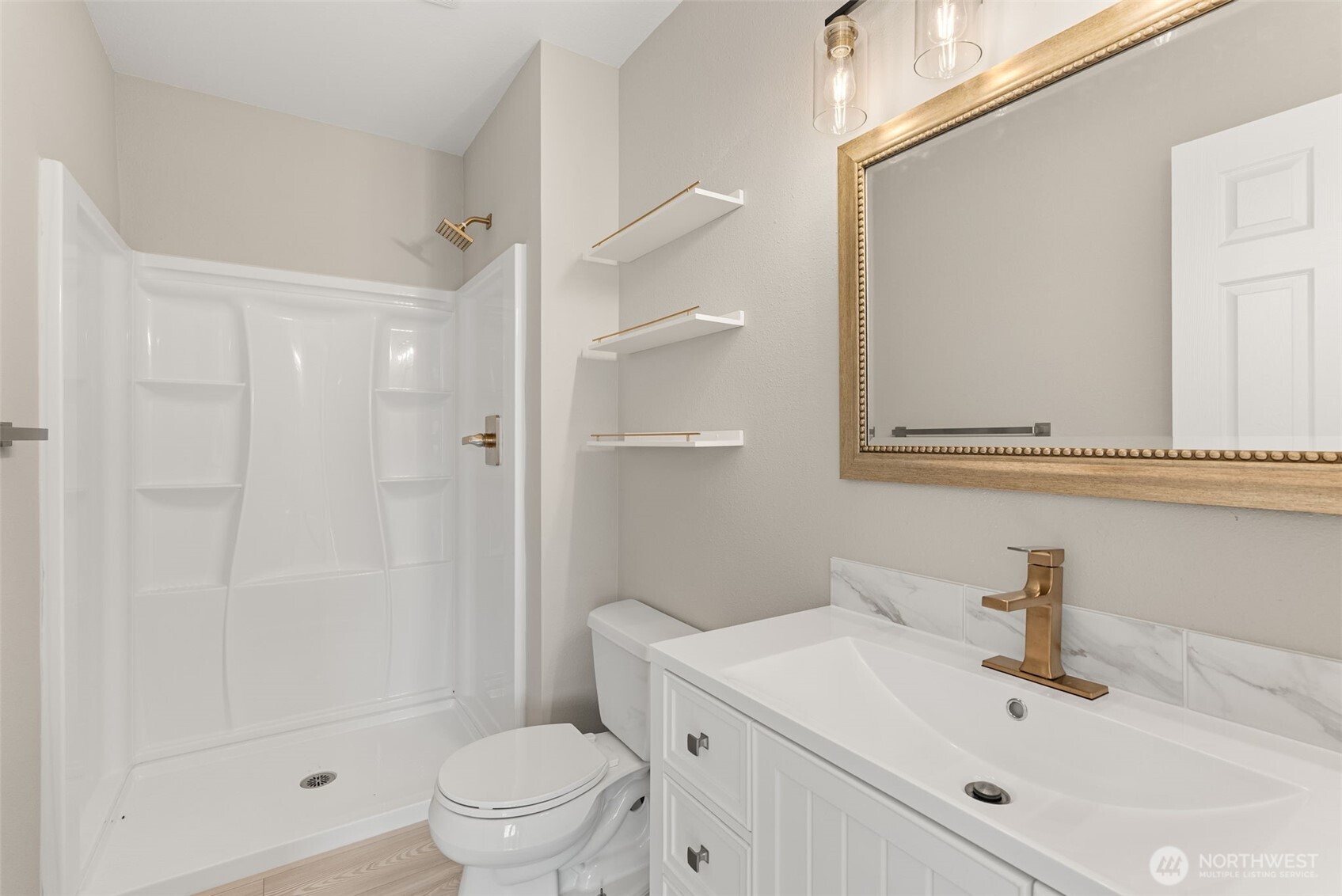 269 Elk Creek Road Raymond, WA 98577 - Photo 21 of 38 a bathroom with a sink toilet and shower