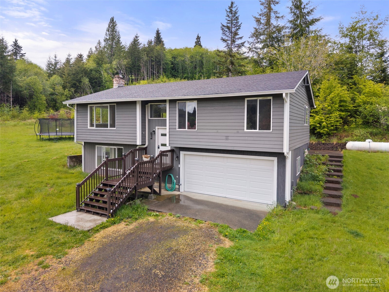 269 Elk Creek Road Raymond, WA 98577 - Photo 23 of 38 a front view of a house with garden