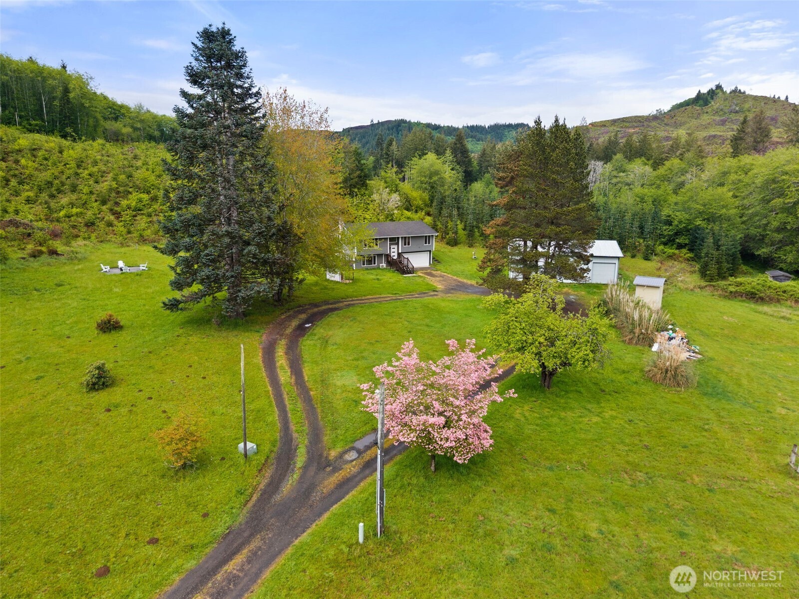 269 Elk Creek Road Raymond, WA 98577 - Photo 25 of 38 a swimming pool with trees in the background