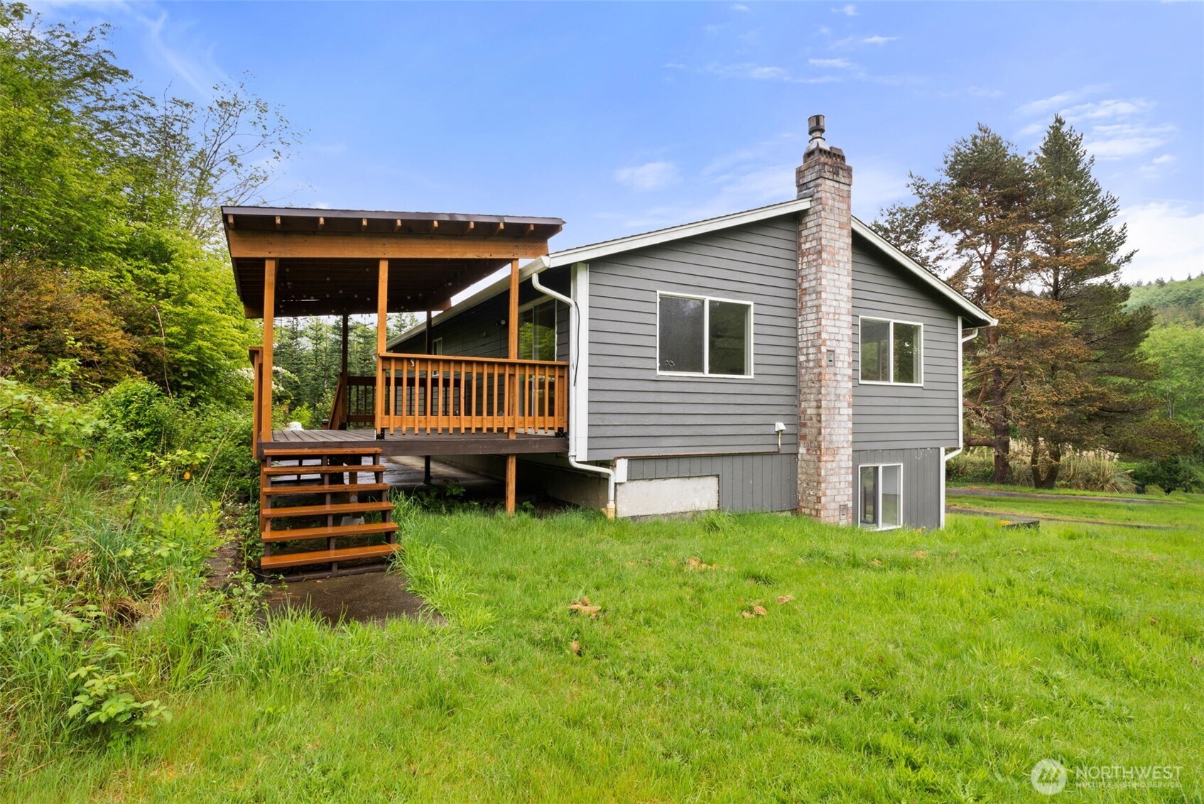 269 Elk Creek Road Raymond, WA 98577 - Photo 26 of 38 a front view of a house with garden