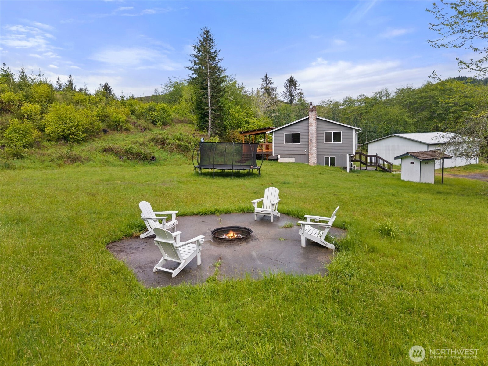 269 Elk Creek Road Raymond, WA 98577 - Photo 30 of 38 a view of a house with a yard
