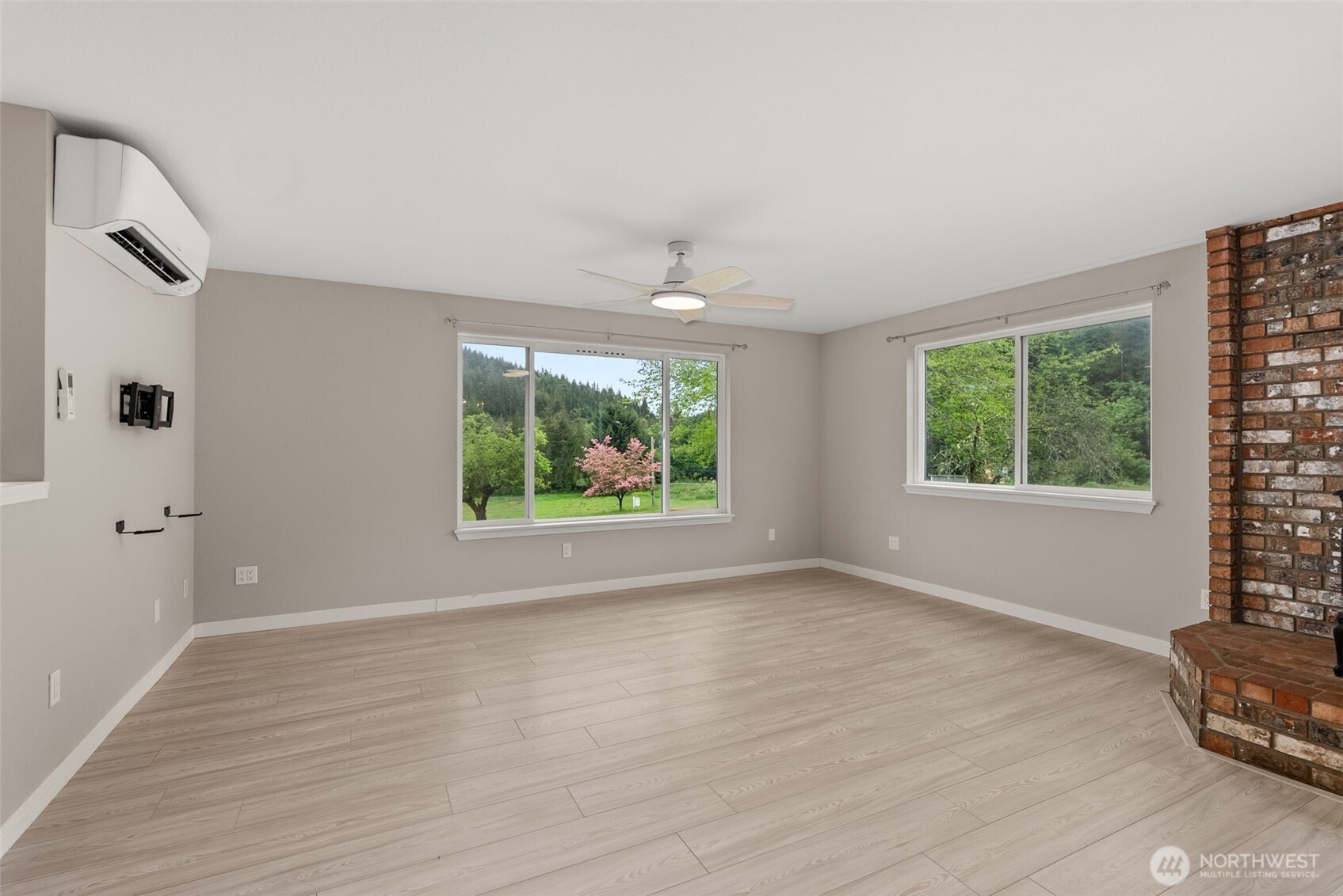 269 Elk Creek Road Raymond, WA 98577 - Photo 3 of 38 wooden floor in an empty room with a window