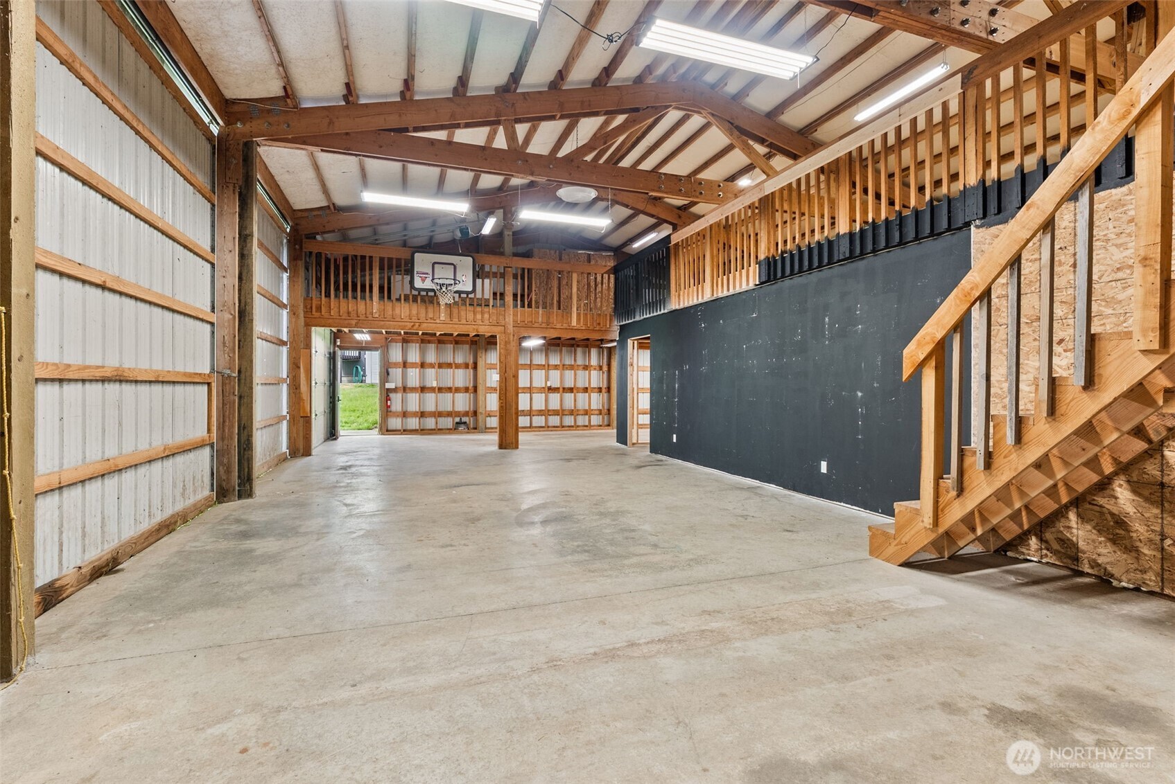 269 Elk Creek Road Raymond, WA 98577 - Photo 33 of 38 a view of an empty room with wooden walls
