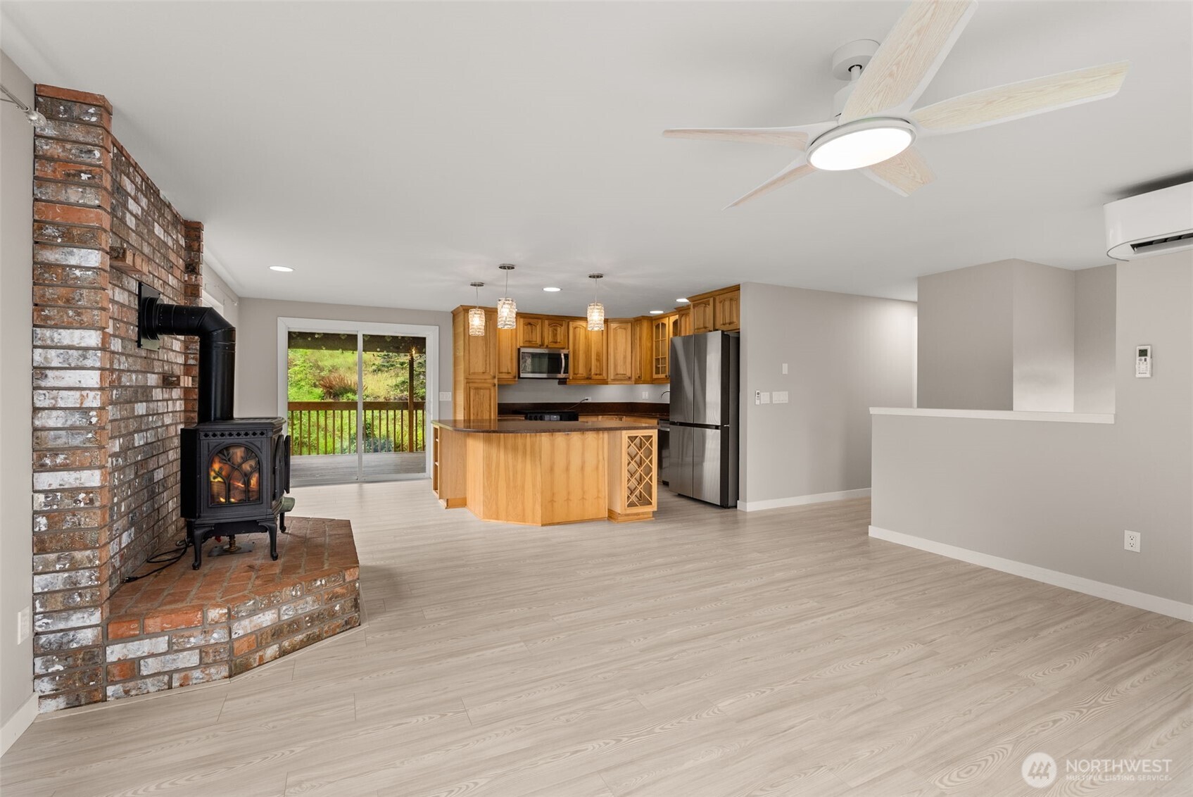 269 Elk Creek Road Raymond, WA 98577 - Photo 5 of 38 a view of kitchen with furniture and wooden floor