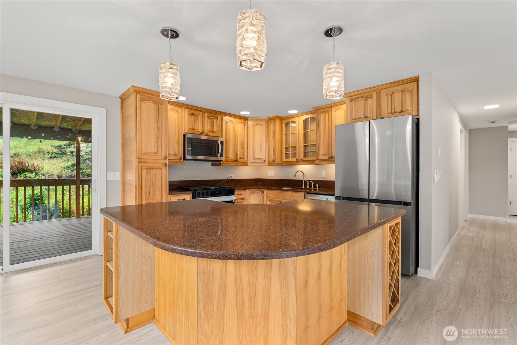269 Elk Creek Road Raymond, WA 98577 - Photo 6 of 38 a kitchen with stainless steel appliances granite countertop a sink a refrigerator and a stove