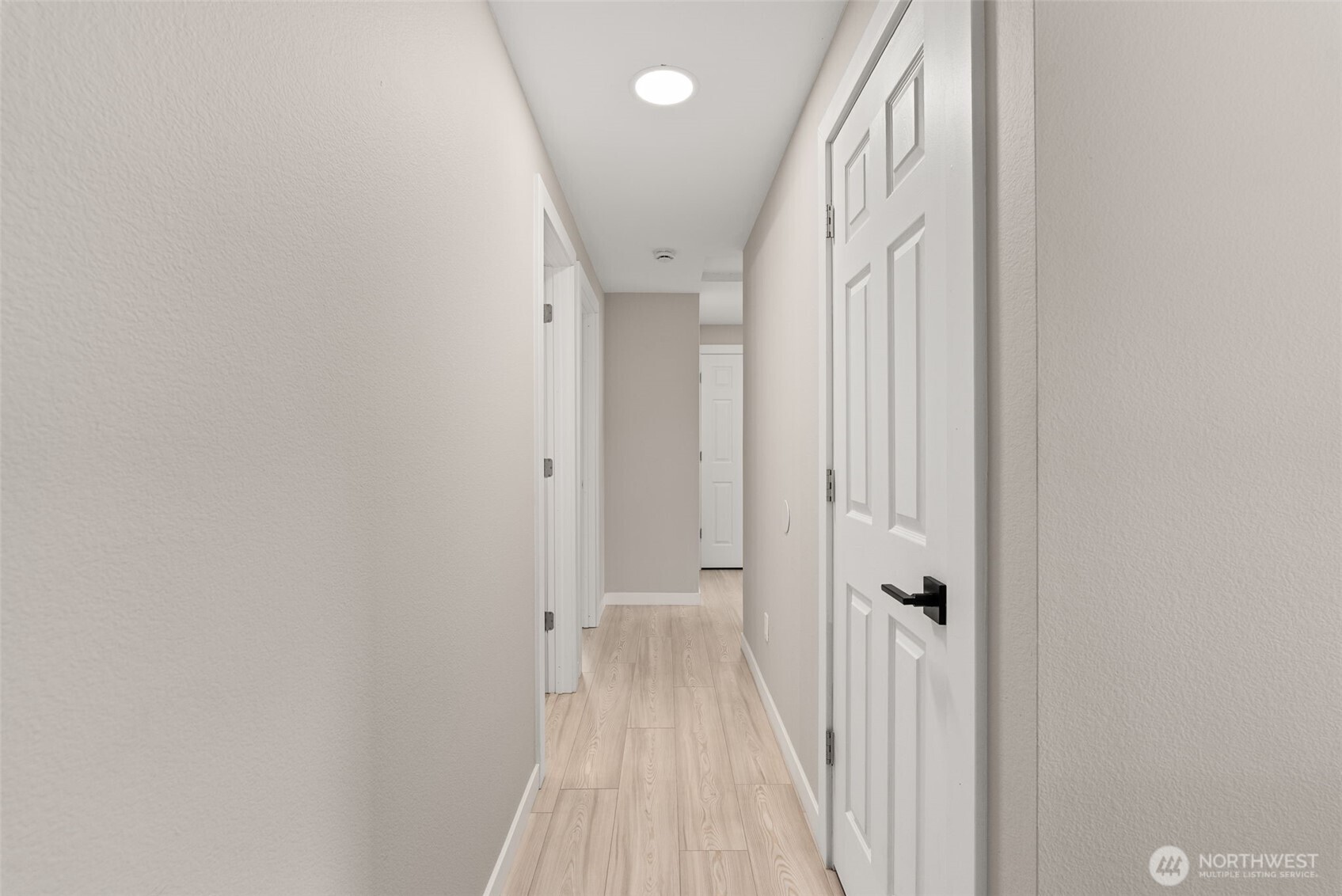 269 Elk Creek Road Raymond, WA 98577 - Photo 10 of 38 a view of a hallway with wooden floor and staircase