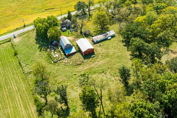 an aerial view of residential houses with swimming pool