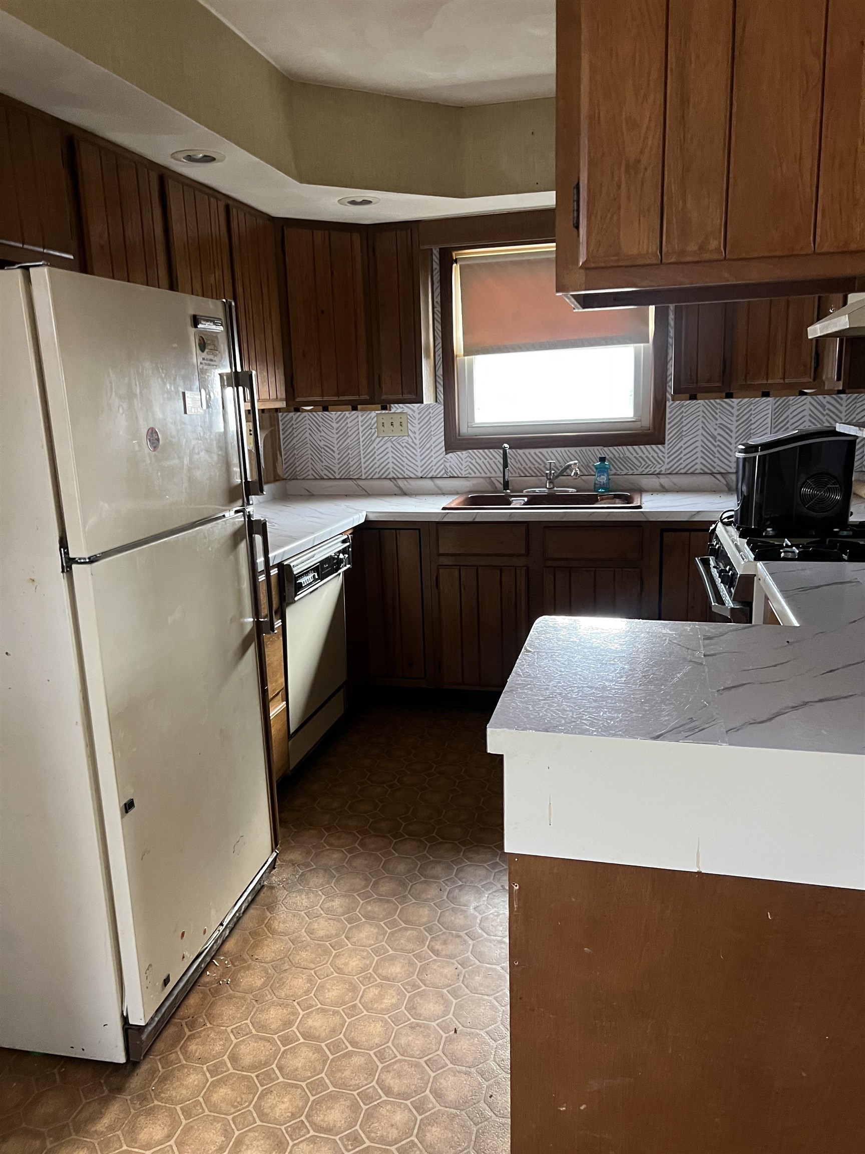 4304 West Lily Creek Road Freeport, IL 61032 - Photo 6 of 43 a kitchen with granite countertop a refrigerator and a sink