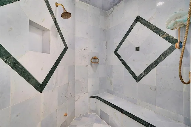 a dining room with furniture and a floor to ceiling window