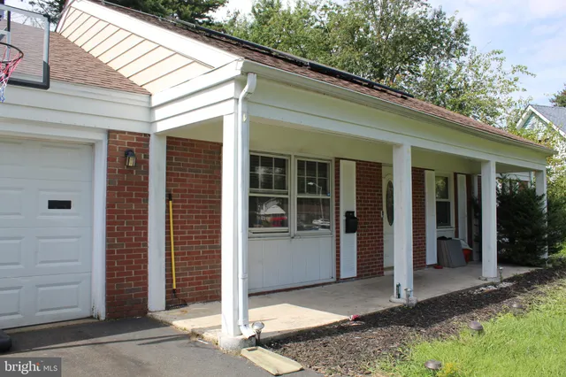 a front view of a house with a porch