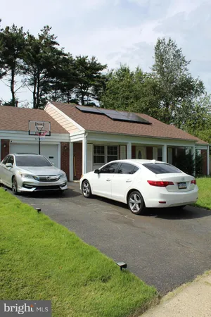 a car parked in front of a house