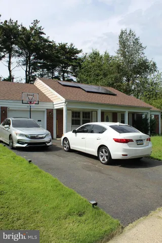 a car parked in front of a house