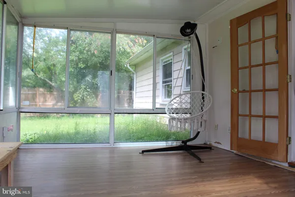 a view of a porch with a floor to ceiling window