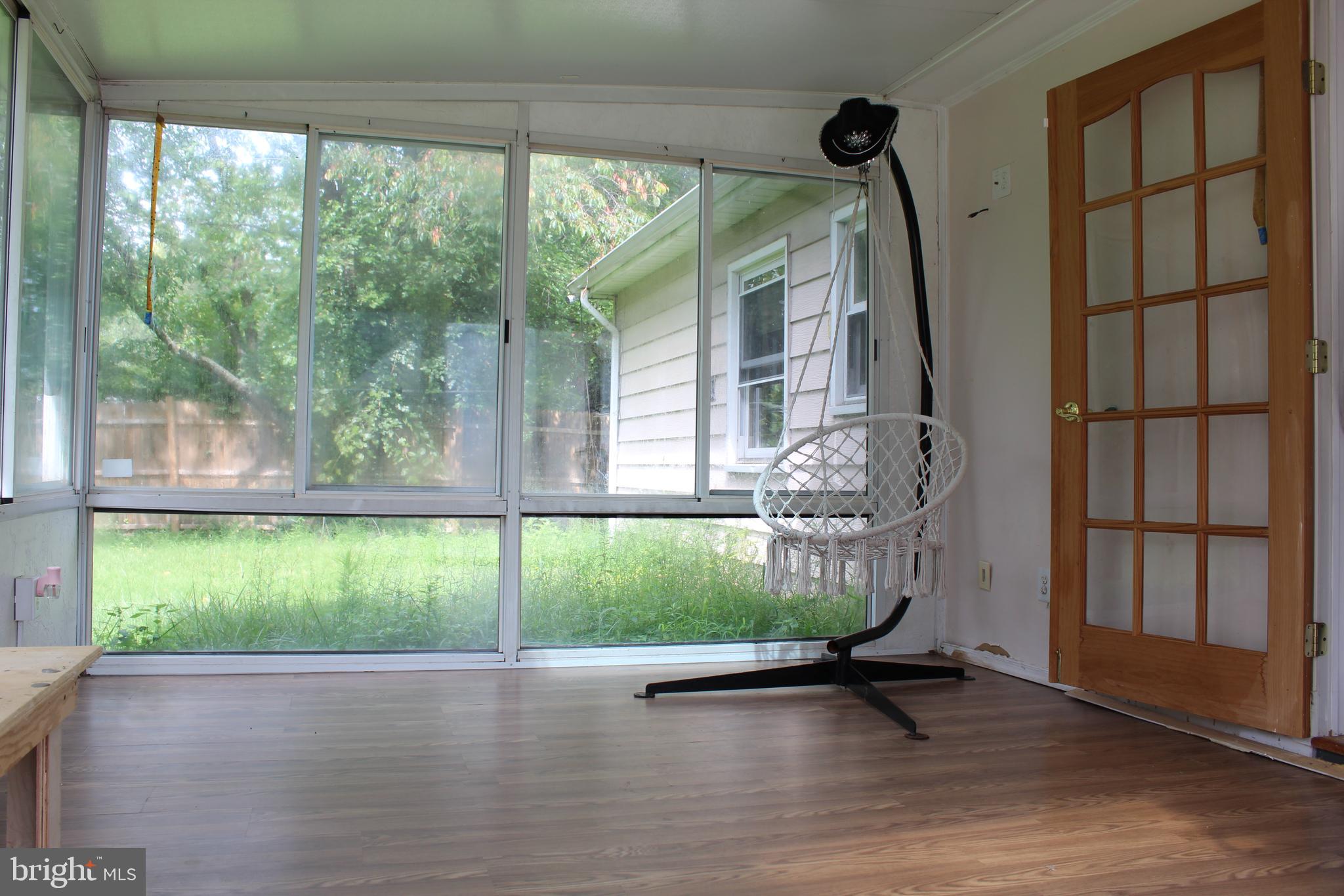 34 Garrison Circle Willingboro, NJ 08046 - Photo 8 of 14 a view of a porch with a floor to ceiling window
