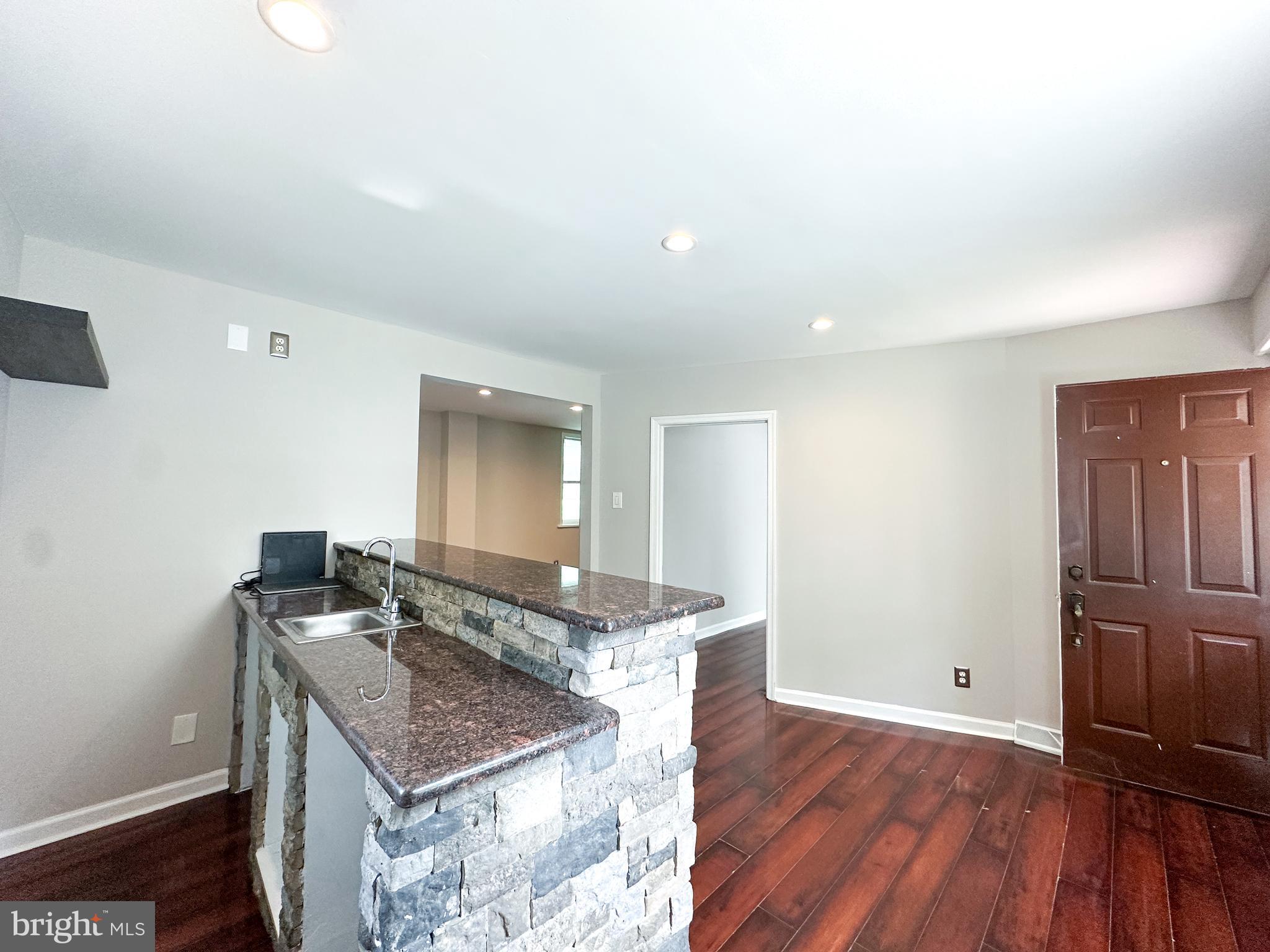 2191 Dunks Ferry Road Bensalem, PA 19020 - Photo 20 of 33 a kitchen with sink cabinets and wooden floor