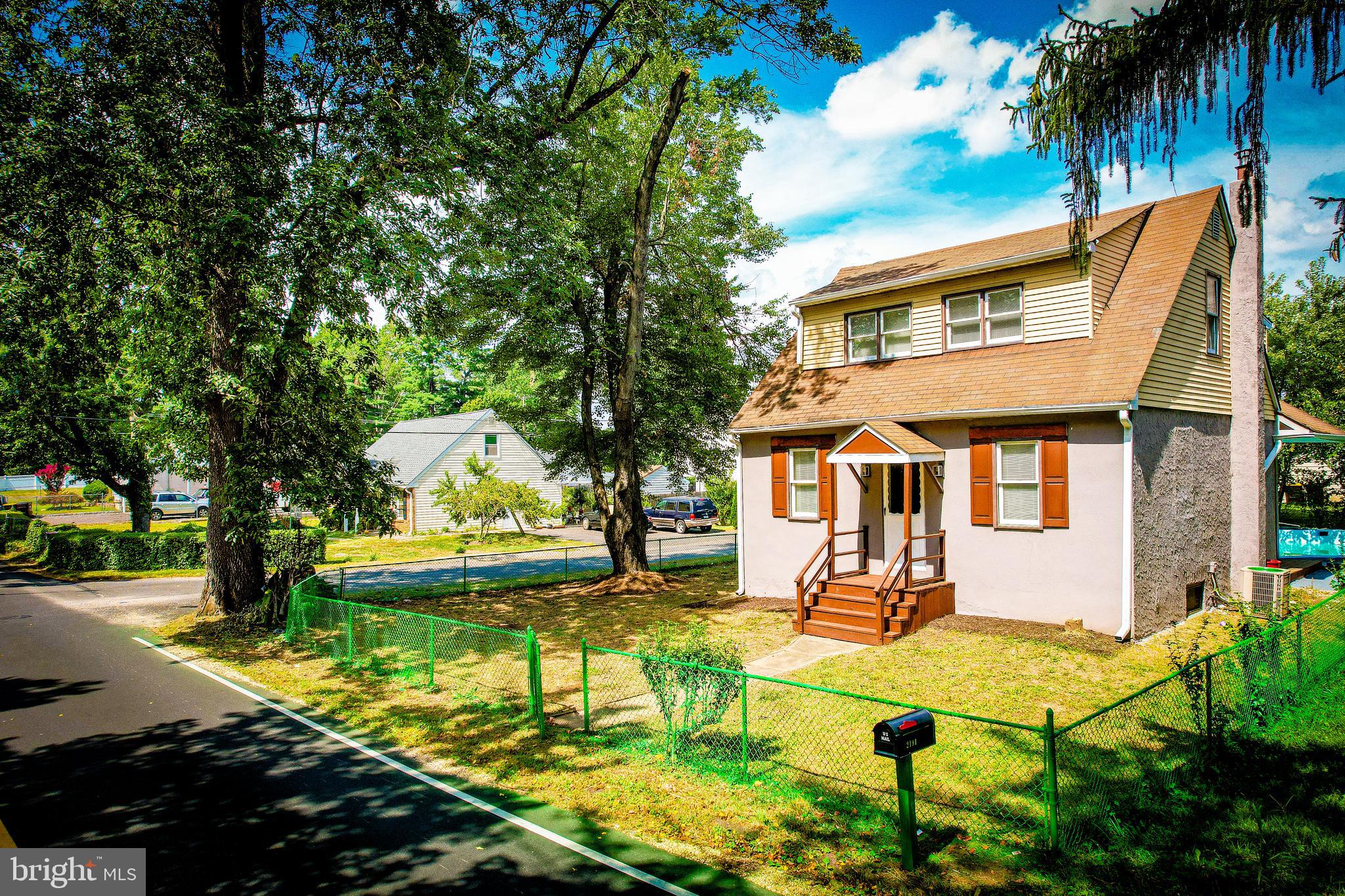 2191 Dunks Ferry Road Bensalem, PA 19020 - Photo 2 of 33 a front view of a house with a yard table and chairs