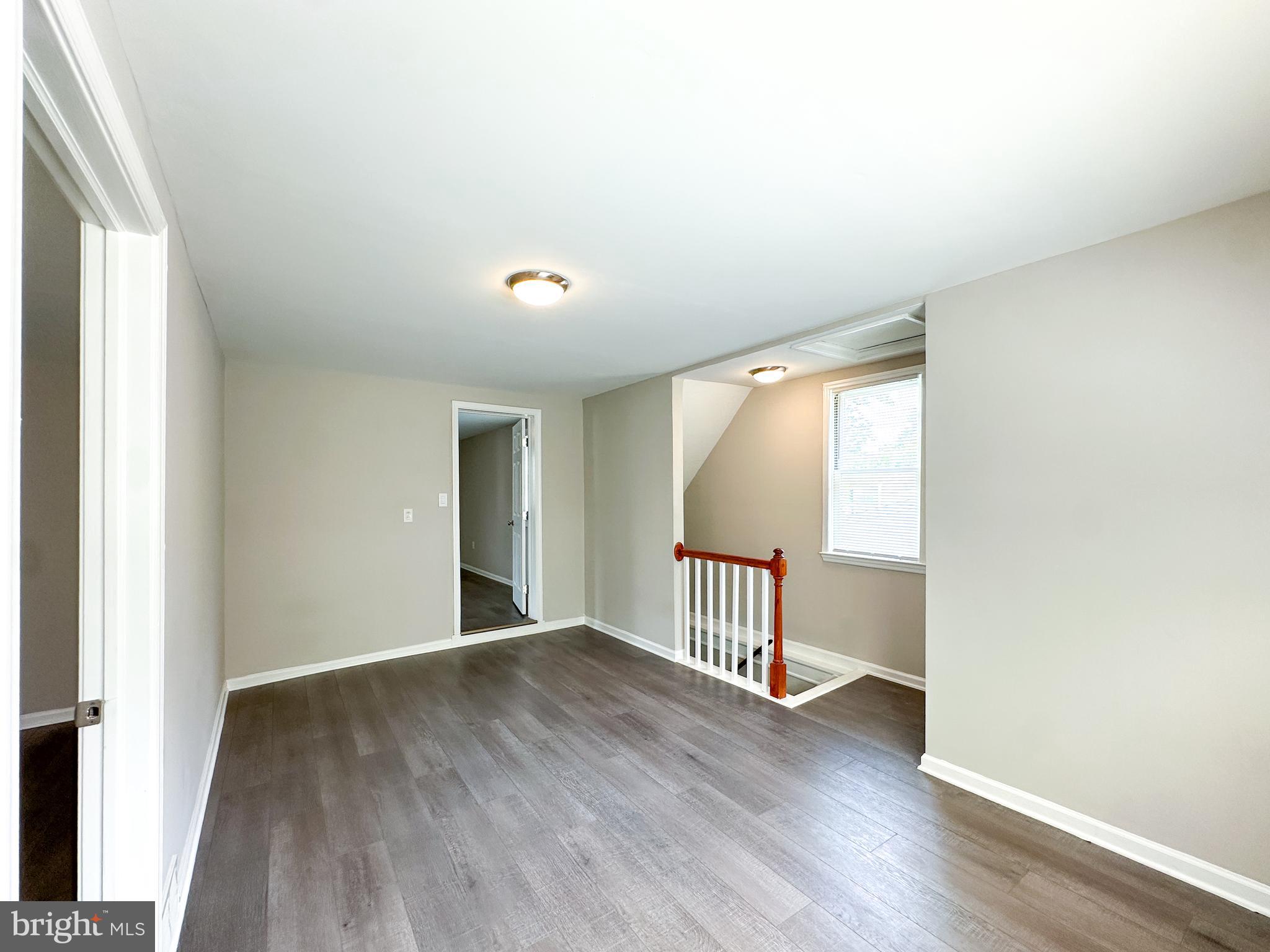 2191 Dunks Ferry Road Bensalem, PA 19020 - Photo 22 of 33 an empty room with wooden floor and windows